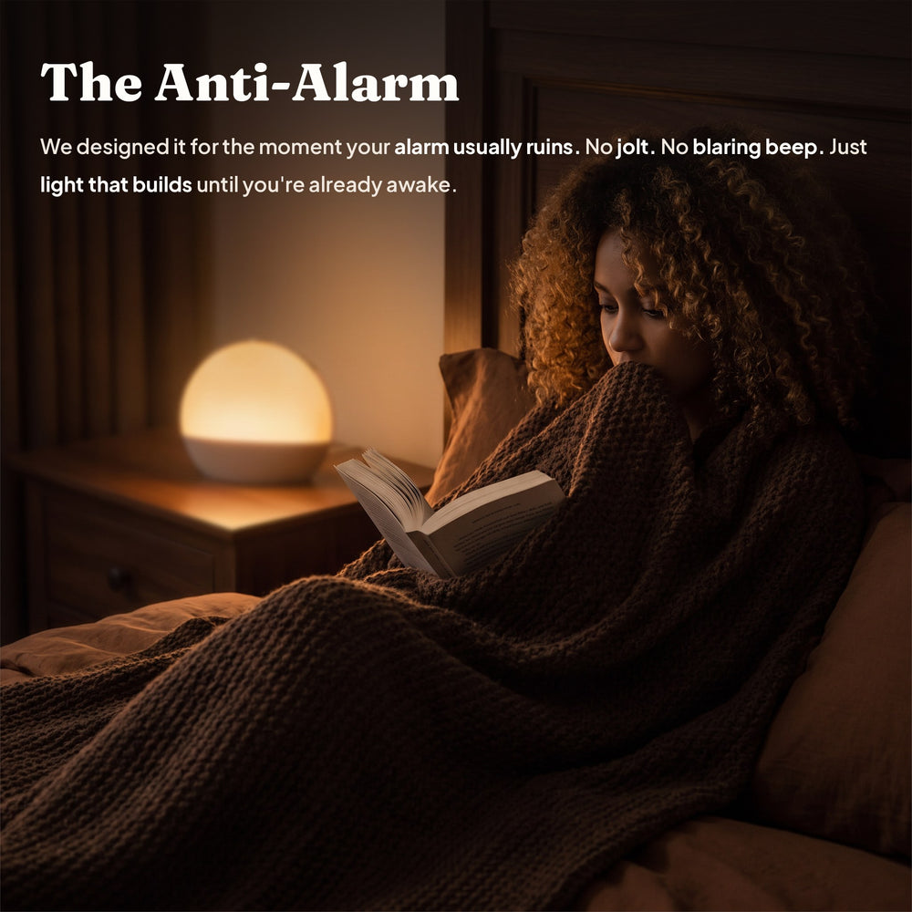Aploomb Sunrise Alarm Clock glowing warm amber light