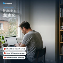 Man slouching at a laptop, shoulders rolled forward towards the screen